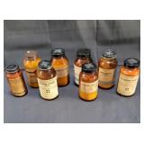 Antique brown apothecary bottles from an old
