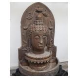 Cememt Buddha head fountain