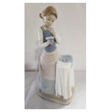 Lladro porcelain figure. Girl ironing. 9.5" tall.