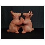 Red dancing dogs statue