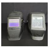 Pair of welding helmets