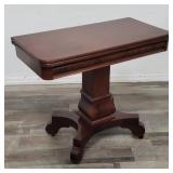 Vintage mahogany folding game table on casters