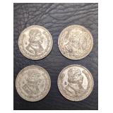 Four silver Mexico One Peso coins. In bag, in