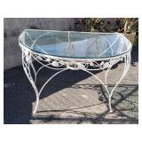 Metal patio table with glass top