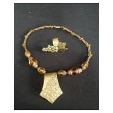 Pair of Depose amber glass and brass necklace,