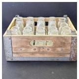Antique wood milk crate with 20 glasses