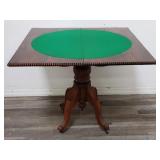 Mahogany folding game table on casters
