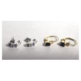 Pair of 10KT diamond earrings with purple and