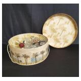 Vintage hat box of various perfume bottles