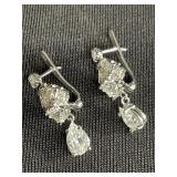 14 Kt white gold and diamonds earrings, largest