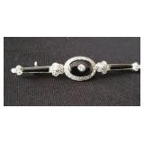 18kt gold pin with diamonds and black onyx