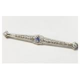 10 kt gold pin with diamonds and blue stone