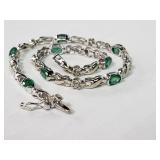 14 Kt white gold bracelet w/ diamonds and green