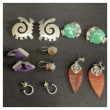 Group of sterling silver earrings with stones