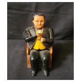 Vintage cast iron coin bank.