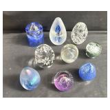 Group of art glass paperweights, three signed