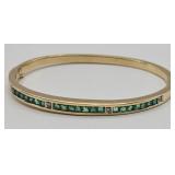 14KT gold diamond bracelet with green stones