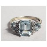 10KT gold ring with light blue stones