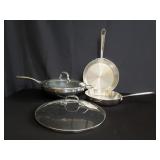 Box of stainless steel pans with lids