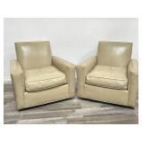 Pair of leather swivel club chairs in the style