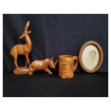 Box of wood figurines and family picture