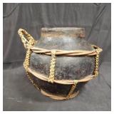 Vintage rattan wrapped terracotta vessle