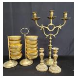 Group of brass candle holders and tiered snack