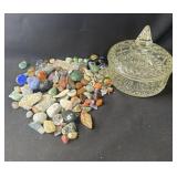 Group of assorted stones in glass candy dish