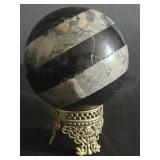 Stone orb on brass stand