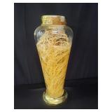 Plant in glass jar with liquid, possibly ginseng