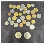 Group of foreign coins with two Kennedy half