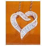 Sterling silver heart shaped with chain . Bronze