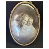 Antique brass oval framed photo