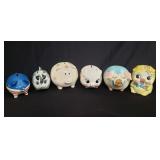 Group of ceramic and wood piggy banks