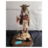 Kachina doll in display case