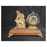 Vintage "Ansonia" figural metal clock on footed