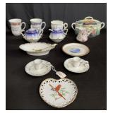 Group of porcelain cups and saucers, candle