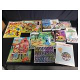 Box of VHS, puzzles, music notes etc