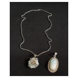 Pair of sterling silver clasp and pendants with