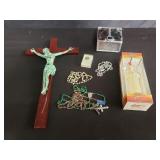 Box of religious crucifix, rosary etc