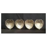 Group of heart-shaped sterling silver repousse