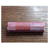 Roll of 1945-S Lincoln Wheat Cent coins. In case