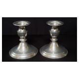 Pair of weighted pewter candle holders