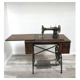 Antique white rotary treadle sewing machine with