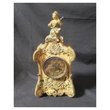 Vintage figural metal mantel clock