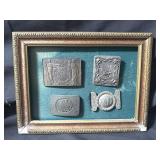 Framed vintage brass belt buckles