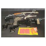 Box of vintage toy guns and lighters