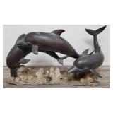 Large bronze dolphin sculpture on bronze base