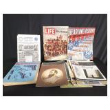 Box of gun magazines and Viking news magazines