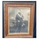 Framed embellished photogravure on paper under